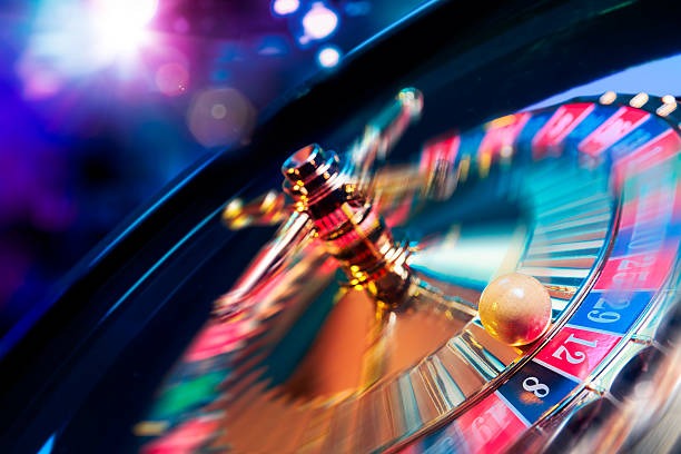 Joker Gaming in-game interface showing stake selector, game canvas, and spin button on mobile